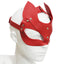 A mannequin head wears a red fox face mask with slanted eye holes, showing the silver stud buttons holding it together.