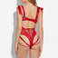 Back view of a model wearing a red teddy with a corset-style criss-cross detail at the small of the back and strappy rear.