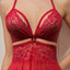 Close up of a red cutout lace and mesh babydoll with a diamanté cleavage charm.
