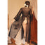 Back view of a model wearing a sheer black robe that features long sleeves with lace-trimmed cuffs. 