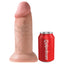 A realistic 10 inch chubby veiny dildo stands against a can by Pipedream showcasing the scale.