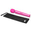 A magenta vibrating massager lays next to its black case.
