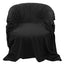 A black waterproof soft blanket is draped over a chair. 