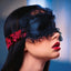 Scandal Ruffled Tie-Up Eye Mask has ruffle lace trim + double-stitched designer red & black brocade ties for an adjustable, comfortable fit. Editorial.