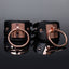 Coquette Luxury Vegan Leather Cuffs With Interlocking O-Rings have rose gold hardware for a high-end look w/ detachable snap gate O-rings that work w/ bondage accessories or attached to each other.
