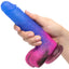 Naughty Bits® Ombré Hombre™ - Vibrating Dildo - 10 toe-curling vibration modes packed into a realistic-feeling firm yet flexible silicone body, complete with sculpted details & suction cup base. Glitter look, blue top becoming pink at base. in hand for size comparison