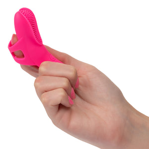 A hand model wears a pink nubby textured silicone finger vibrator for scale.