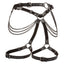 A multi-chain thigh harness with leather straps and metal O-ring lays against a white backdrop. 