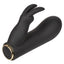 A black rabbit eared petite clitoral dual vibrator lays flat and showcases its gold ring base and power button. 