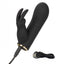 A black rabbit eared clitoral dual vibrator lays next to its charging cord. 