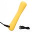 A mini yellow wand vibrator lays flat against a white backdrop next to its charging cord. 