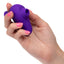 A hand model holds a mini purple clitoral suction finger vibrator for scale. 