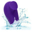 A mini purple clitoral suction finger vibrator is shown in water showcasing its waterproof design. 