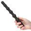 A hand model holds a black silicone anal bead wand vibrator. 