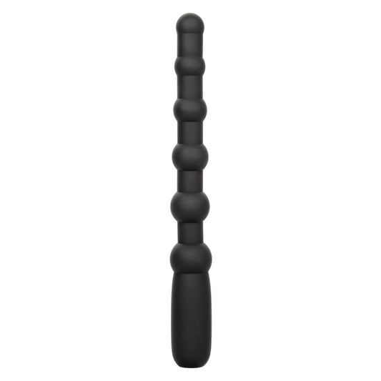 A black silicone wand of anal beads stands against a white backdrop. 