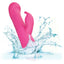 A pink rotating beaded rabbit vibrator is shown thrown in water for its waterproof design. 