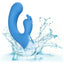 A blue rabbit clitoral suction g-spot vibrator is thrown in water to showcase its waterproof design.