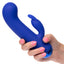 A hand model holds a blue chubby g-spot rabbit vibrator for scale. 