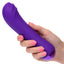 A hand model holds a purple thick g-spot vibrator for scale. 