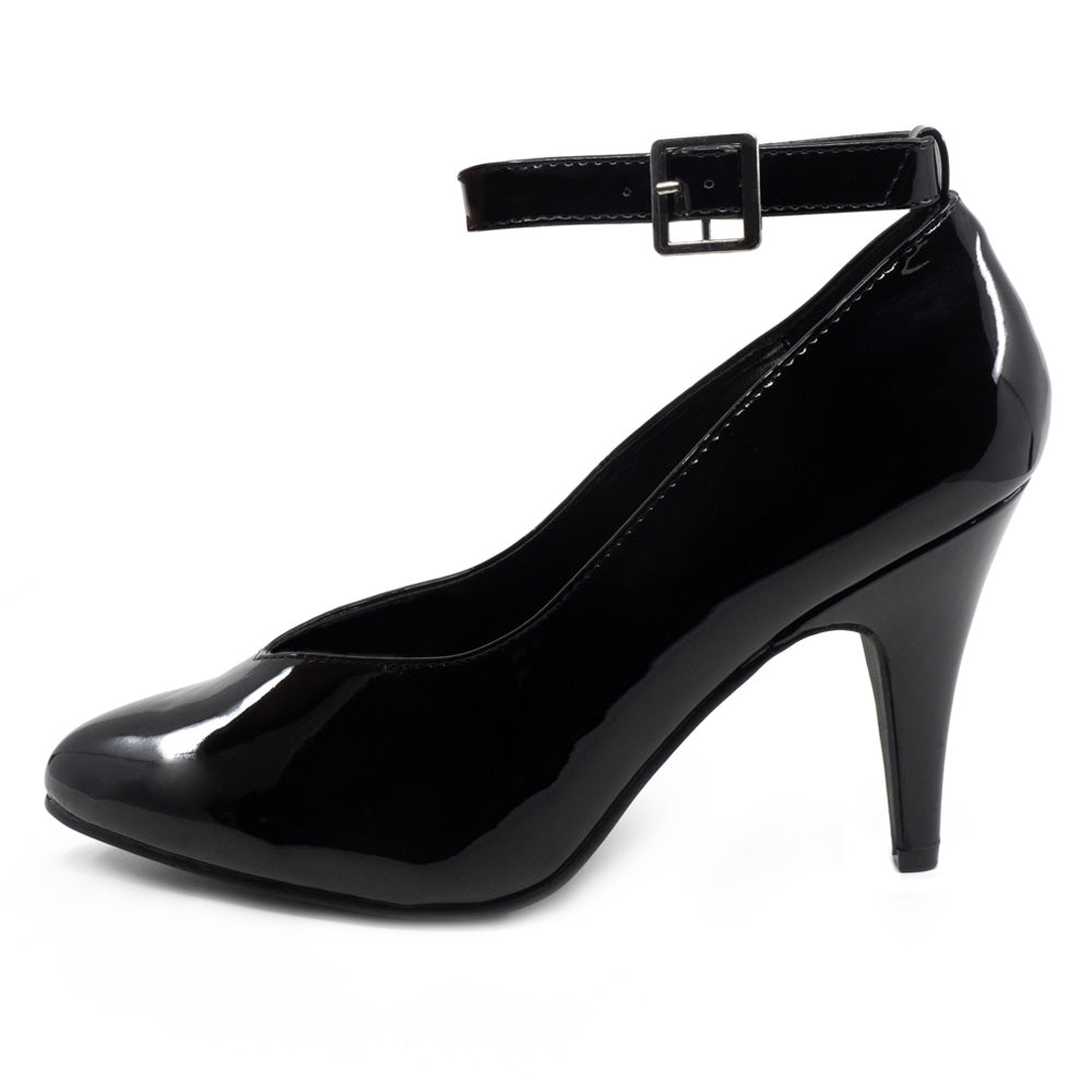 A side view of a single black patent pump with a low vamp and buckle ankle strap sits against a white backdrop.
