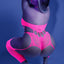 Back view of a model wearing a neon pink bodystocking with attached suspender detail that connects to fishnet thigh-highs.