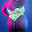 Back view of a plus-size model wearing a glow-in-the-dark teddy with criss-cross shoulder straps and cheeky bottoms.