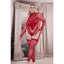 A plus size model wears a red long sleeve footless fishnet bodystocking with v shape pattern down the front.