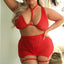 A plus size model wears a red wire free bralette, garter skirt and panty set with V-shaped triple strap design on the skirt.