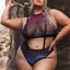 A plus size model wears an iridescent indigo mesh halter top and shoulder suspenders attached to the panty waistband.