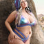 A close up view of plus size model wearing Fantasy Lingerie bralette and panty in a purple and pink holographic finish. 