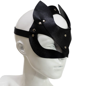 Side view of a mannequin wearing a black faux leather fox mask with pointed ears and angular eye openings.