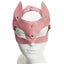 Front view of a pink faux leather fox face mask with wide slanted eye holes and pointed ears worn on a mannequin head.