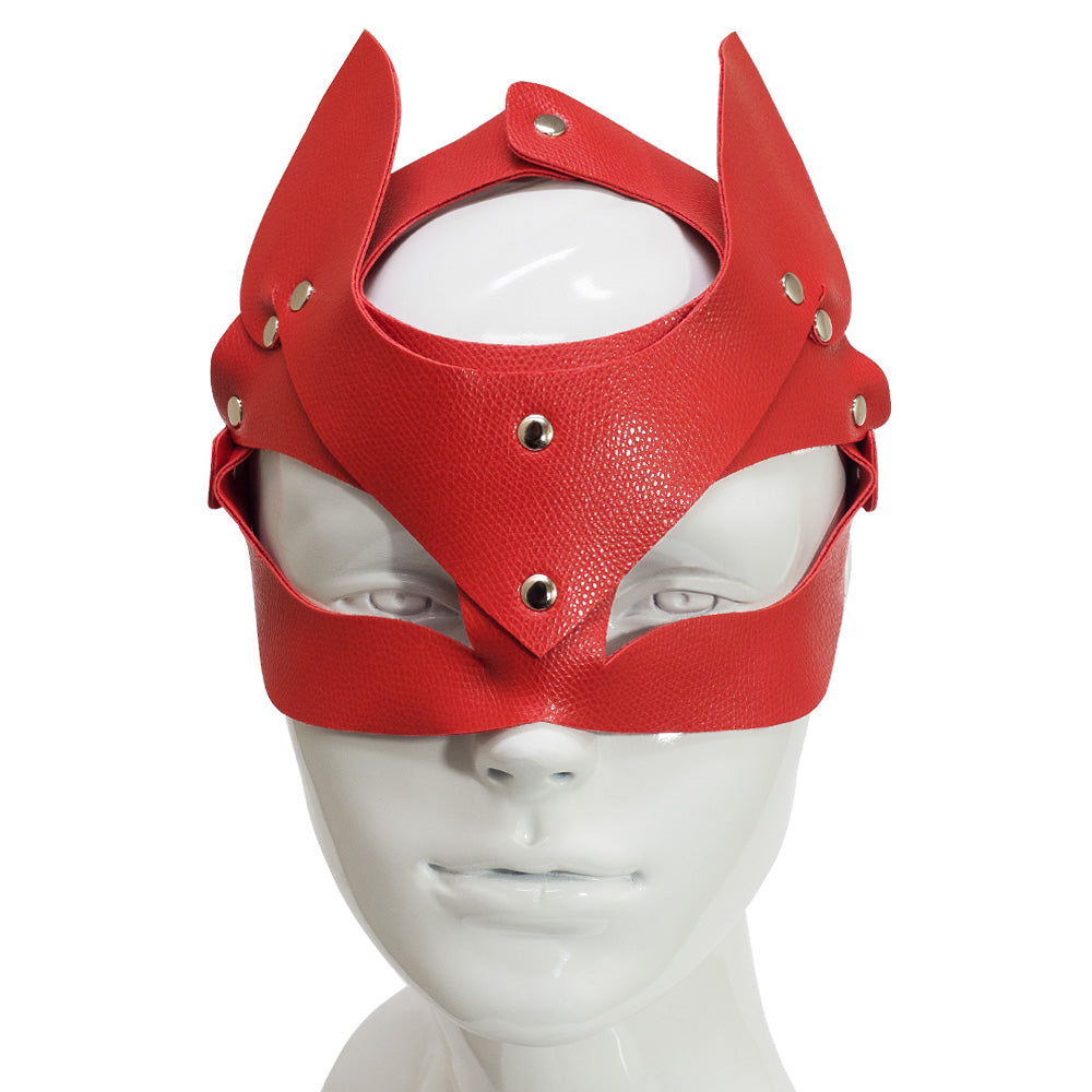 Front view of a red faux leather fox face mask with wide slanted eye holes and pointed ears worn on a mannequin head.