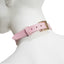 Back view of baby pink leather choker collar shows its gold adjustable buckle & leather tail keeper on a mannequin's neck.