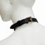 Back view of black leather choker collar shows its gold adjustable buckle & leather tail keeper on a mannequin's neck.