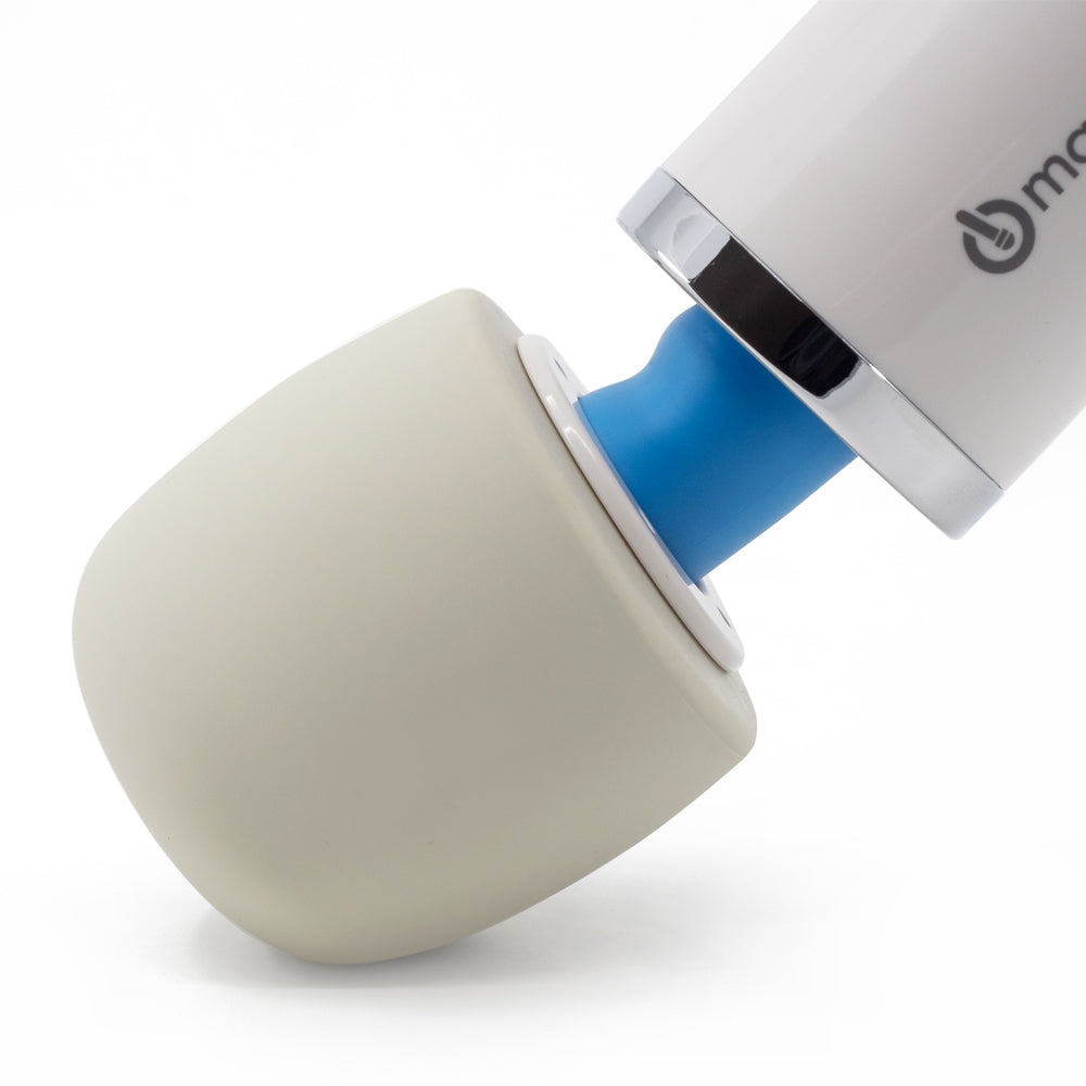 A close-up of the Hitachi Magic Wand vibrating massager's silicone head pressed at an angle to show its flexibility.