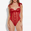 A model wears a sheer red rose-patterned mesh teddy with frilly petal edges above the cups and satin-tie shoulder straps.