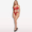 A model wears a sheer red bralette top and panty set with detachable suspenders attaching the top to the bottom.