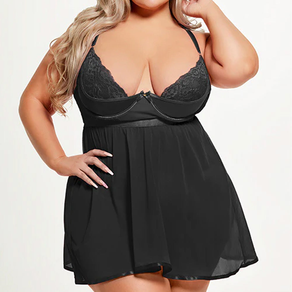 A plus-size model wears a black babydoll with lace and microfibre underwired cups and a sheer mesh skirt over a G-string.