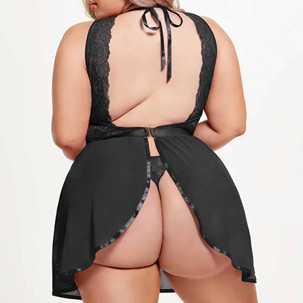 Back view of a curvy model wearing a black halter-tie babydoll with lace shoulders framing the open back and flyaway skirt.