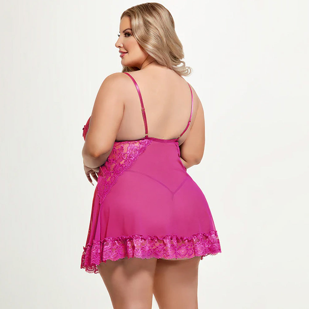 Back view of a curvy model wearing a sheer pink mesh babydoll with adjustable elastic satin shoulder straps.
