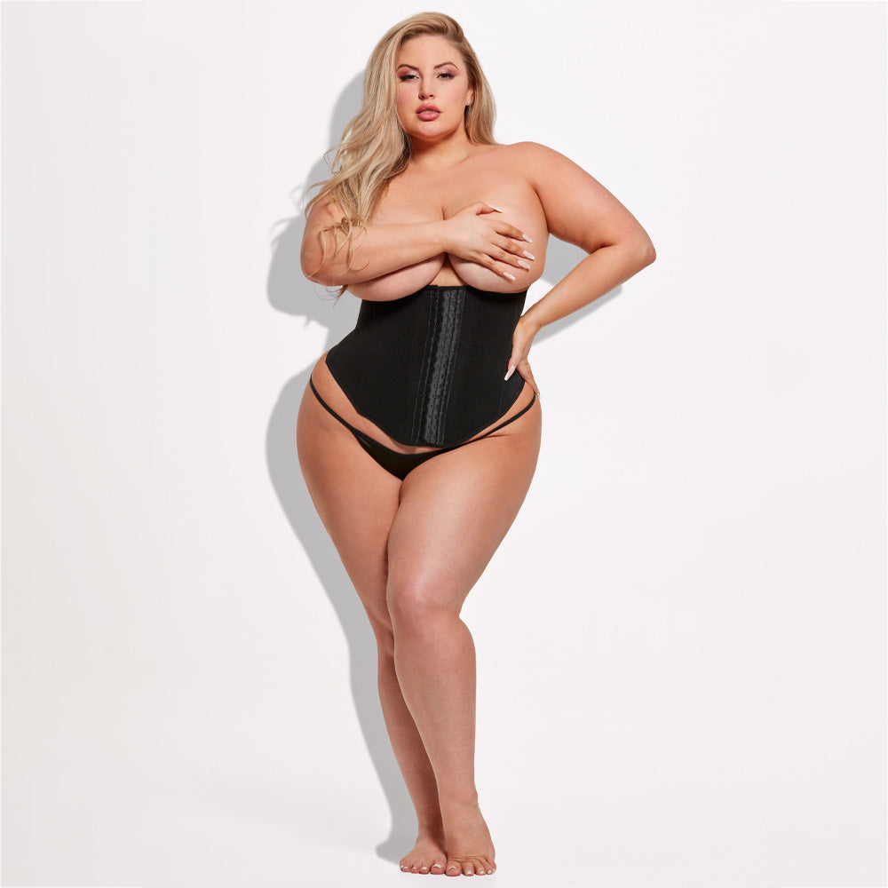 A curvy model wears a power mesh shaping waist trainer with an underbust design and supportive boning in black.