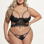 A curvy model wears a black longline bra and panty that combines cutouts, sheer mesh and scalloped eyelash lace trim.