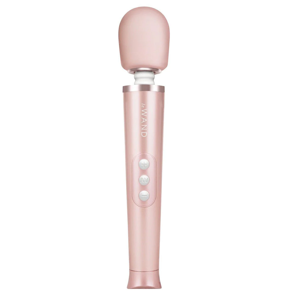 A rose gold petite rechargeable vibrator stands against a white backdrop and features a soft silicone bulbous head. 