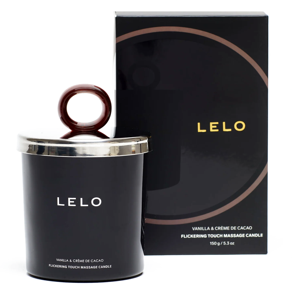 A Lelo vanilla and creme de cacao candle sits next to its package against a white backdrop.
