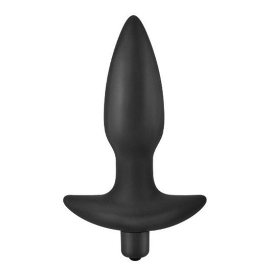A black silicone anal plug stands against a white backdrop with a rigid tapered tip.