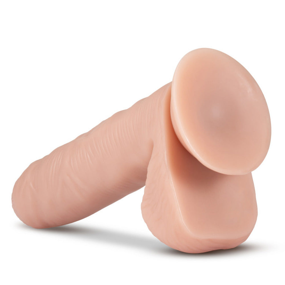 Back view of Loverboy Tony The Waiter realistic uncircumcised dildo features suction cup base. 