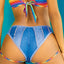 Close-up back view of a model wearing bikini-cut denim print panties with raised stitching and rainbow straps under the rear.