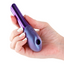 A hand model holds a double-ended air pulse bullet vibrator with a clitoral chamber and 2 buttons.