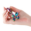 A hand model holds a rainbow metal mini butt plug that features a clover-shaped flared stopper. 